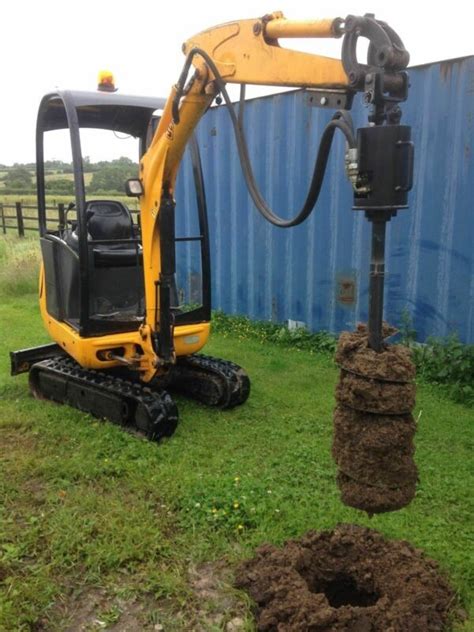 mini excavator auger attachment|mini excavator post hole digger.